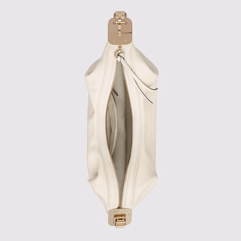 Side profile of elevated signature women's handbag – women's designer-style accessory