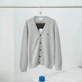 Flat lay presentation of Lacoste luxury clothing with logo-detail design