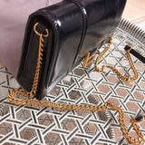 Back view of signature elevated women's handbag – women's designer-style accessory