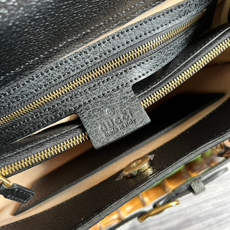 Front view of classic signature women's handbag – women's luxury accessory