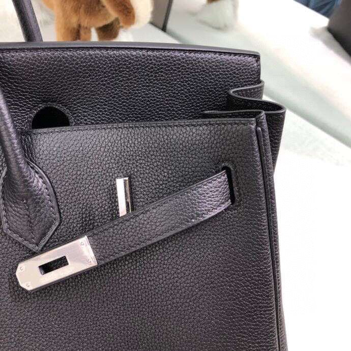Side view of structured structured handbag