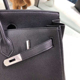 Side view of structured structured handbag