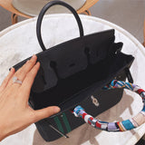  Clean-Lined crossbody bag carried on shoulder