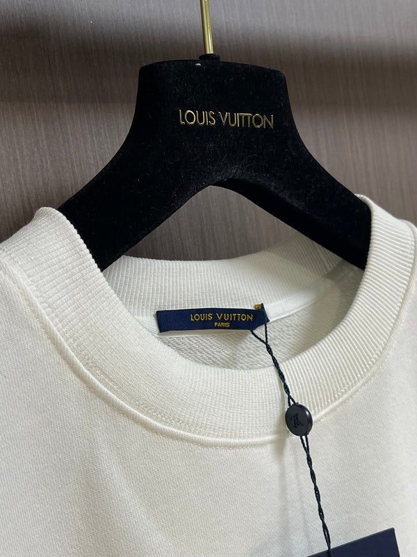 Front view of Louis Vuitton luxury clothing with tailored silhouette