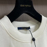 Front view of Louis Vuitton luxury clothing with tailored silhouette