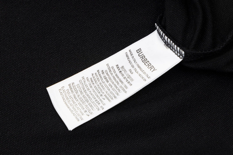 Close-up detail shot of Polo cotton polo shirt with monogram-inspired silhouette