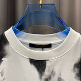 Flat lay presentation of Louis Vuitton cotton t-shirt with signature branding