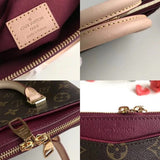 Handle and strap detail of signature everyday-luxe women's handbag – women's statement bag