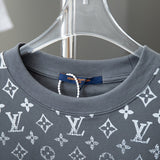 Close-up detail shot of Louis Vuitton cotton t-shirt with signature branding