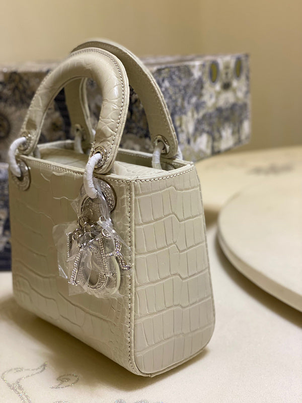 Styled lifestyle shot of everyday-luxe structured women's handbag – women's everyday handbag