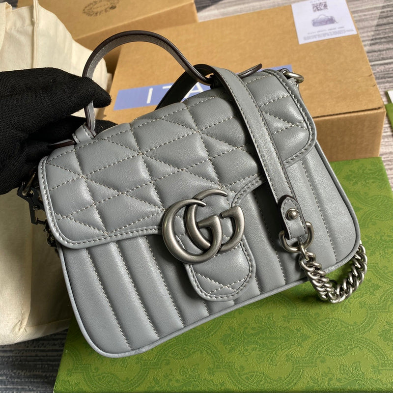 Handle and strap detail of statement polished women's handbag – women's luxury accessory