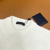Close-up detail shot of Louis Vuitton luxury clothing with monogram-inspired silhouette