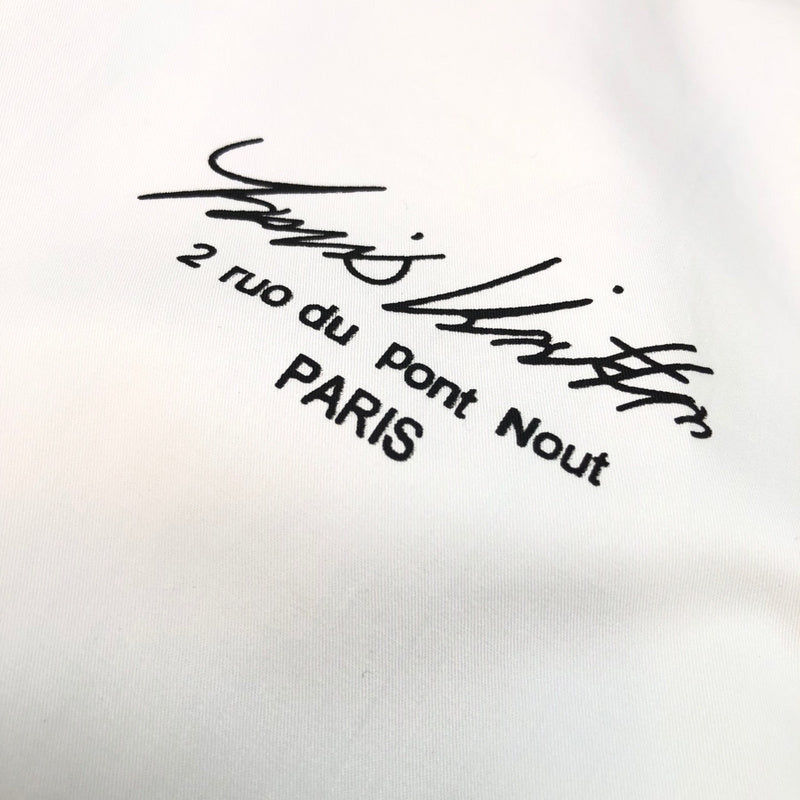 Full styled look of Louis Vuitton luxury clothing with monogram-inspired silhouette