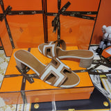 Hermès White Slide Sandals - Heel Detail View