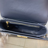Side profile of chic modern women's handbag – women's luxury accessory