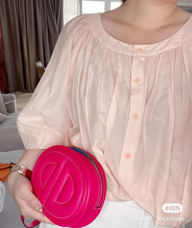 Side view of poised structured handbag
