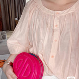 Side view of poised structured handbag