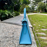 Side view of streamlined structured handbag