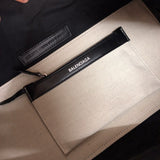 Side profile of chic elevated women's handbag – women's statement bag