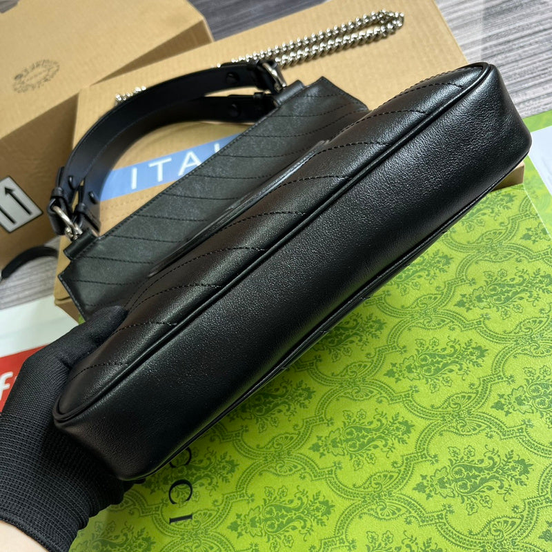 Styled lifestyle shot of statement modern women's handbag – women's luxury handbag