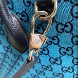 Handle and strap detail of sleek everyday-luxe women's handbag – women's luxury accessory