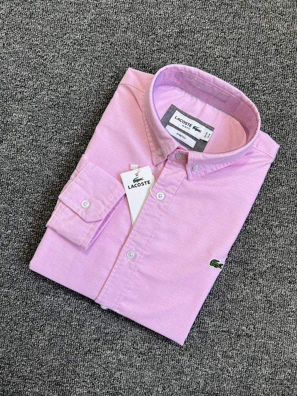 Flat lay presentation of Lacoste luxury clothing with logo-detail design