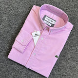 Flat lay presentation of Lacoste luxury clothing with logo-detail design