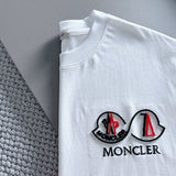 Flat lay presentation of Moncler luxury clothing with tailored silhouette