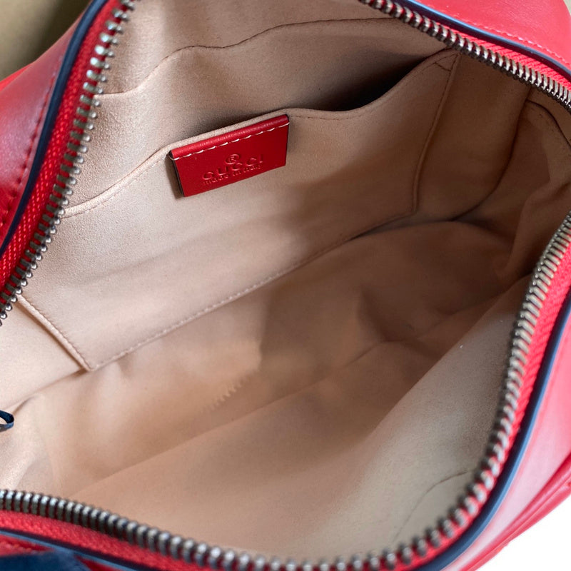 Close-up detail of classic signature women's handbag – women's designer-style accessory