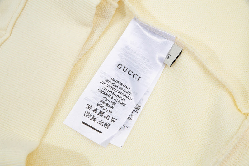 Close-up detail shot of Gucci luxury clothing with tailored silhouette
