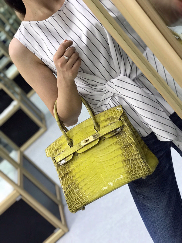 Side view of sculpted structured handbag