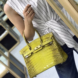 Side view of sculpted structured handbag
