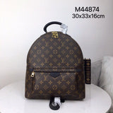 Side profile of signature classic women's handbag – women's statement bag