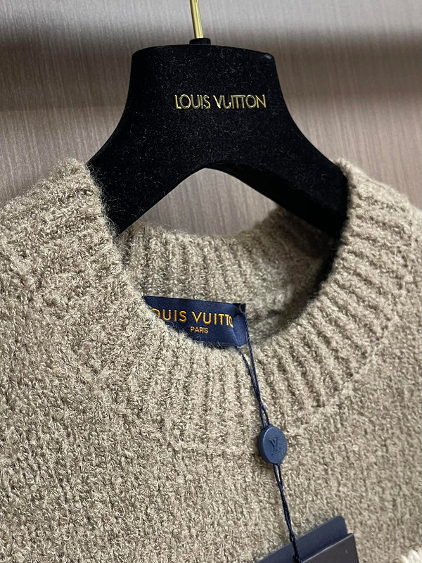 Close-up detail shot of Louis Vuitton luxury clothing with monogram-inspired silhouette