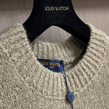 Close-up detail shot of Louis Vuitton luxury clothing with monogram-inspired silhouette