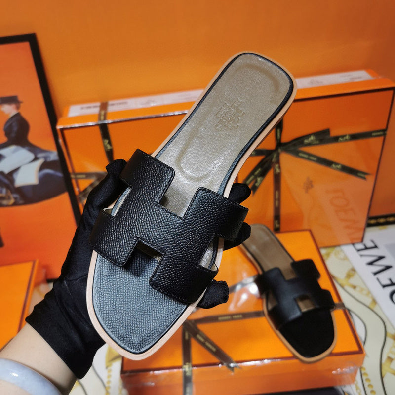 Hermes sandals Style 105 - front view, iconic logo design