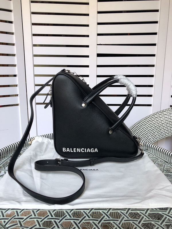 Styled lifestyle shot of refined signature women's handbag – women's luxury handbag