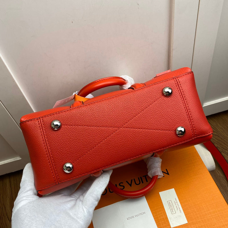Styled lifestyle shot of everyday-luxe signature women's handbag – women's statement bag