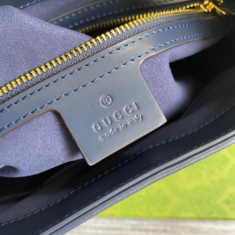 Side profile of polished signature women's handbag – women's designer-style accessory