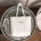 Front view of structured elevated women's handbag – women's designer-style accessory