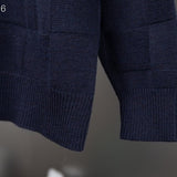 Flat lay presentation of Louis Vuitton luxury clothing with tailored silhouette