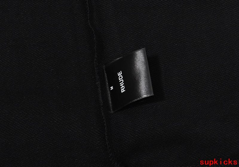 Close-up detail shot of Rhude luxury clothing with everyday silhouette