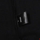 Close-up detail shot of Rhude luxury clothing with everyday silhouette