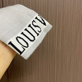 Side profile of Louis Vuitton luxury clothing with signature branding