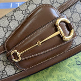 Handle and strap detail of structured polished women's handbag – women's designer-style accessory