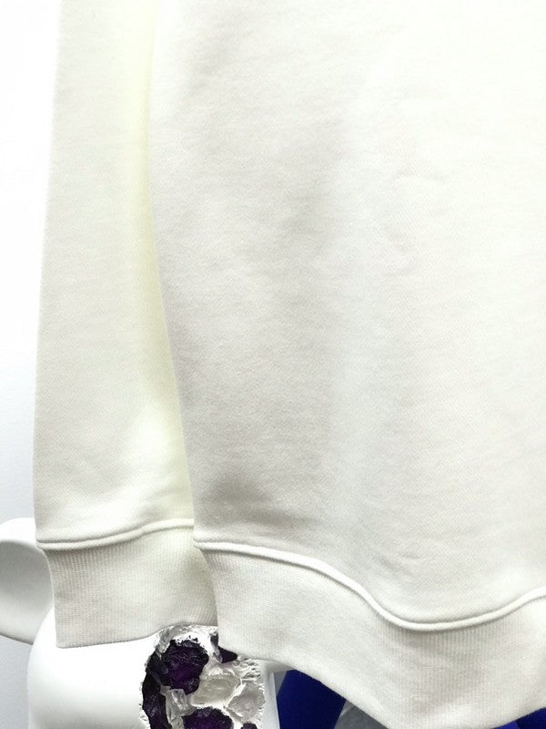 Close-up detail shot of Louis Vuitton luxury clothing with runway-inspired design