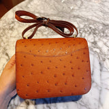 Side view of considered structured handbag