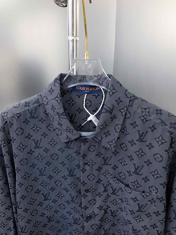 Close-up detail shot of Louis Vuitton luxury clothing with label-forward styling