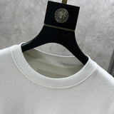 Close-up detail shot of Louis Vuitton luxury clothing with logo-detail design