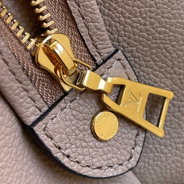 Handle and strap detail of modern structured women's handbag – women's designer-style accessory